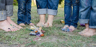 People standing together on grass
